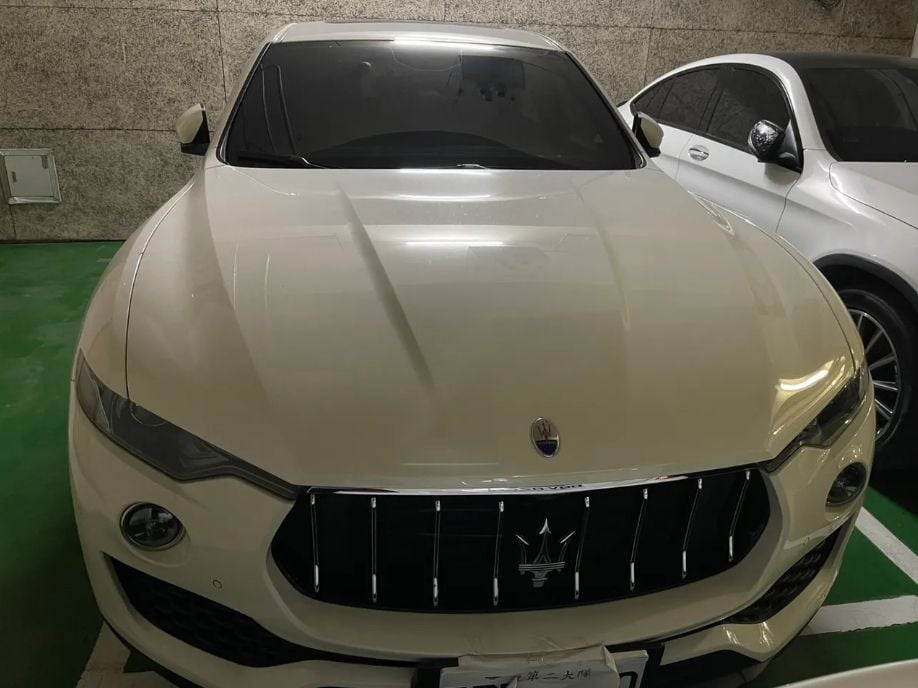 Photo of a seized Maserati tied to the BitShine probe — shows the luxury vehicles authorities confiscated during raids, illustrating the scale of assets recovered.